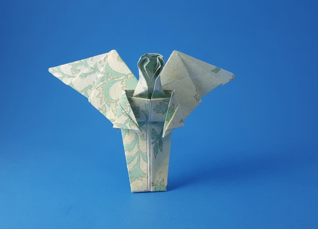 Origami Angel - kneeling or flying by Lore Schirokauer. Folded by Gilad Aharoni on giladorigami.com
