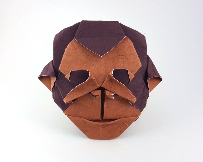 Origami Chimpanzee mask by Roman Diaz. Folded fom a square of double-sided mulberry paper by Gilad Aharoni on giladorigami.com