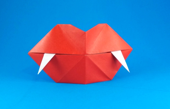 Origami Dracula fangs by Steve Biddle. Folded from a square of origami paper by Gilad Aharoni on giladorigami.com