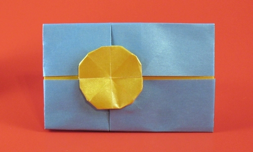 Origami Flag of Palau by Gilad Aharoni. Folded from a square of duo pearl origami paper by Gilad Aharoni on giladorigami.com