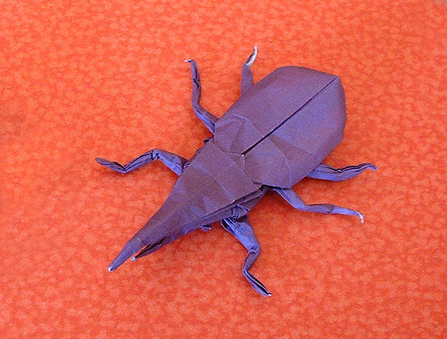 Origami Hercules beetle by Robert J. Lang. Folded from a square of origami paper by Gilad Aharoni on giladorigami.com