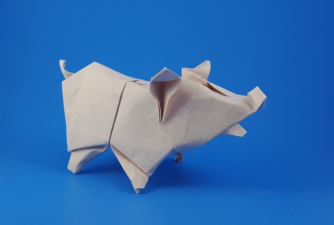 Origami Pig by Zhen-Ming Huang. Wet-folded from a square of Astroparche crepe embossed cardstock by Gilad Aharoni on giladorigami.com