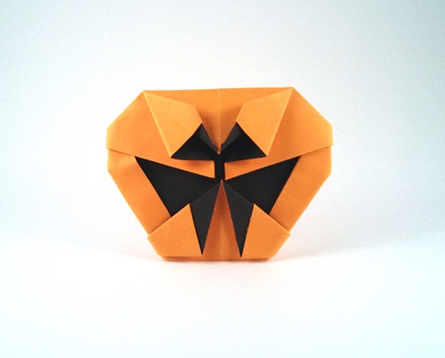 Origami Jack-o'-lantern by Ynyr Lloyd. Folded from a square of watercolor paper by Gilad Aharoni on giladorigami.com