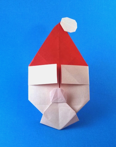 Origami Santa - sober or merry by Gayatri D'Souza. Folded from a square of origami paper by Gilad Aharoni on giladorigami.com