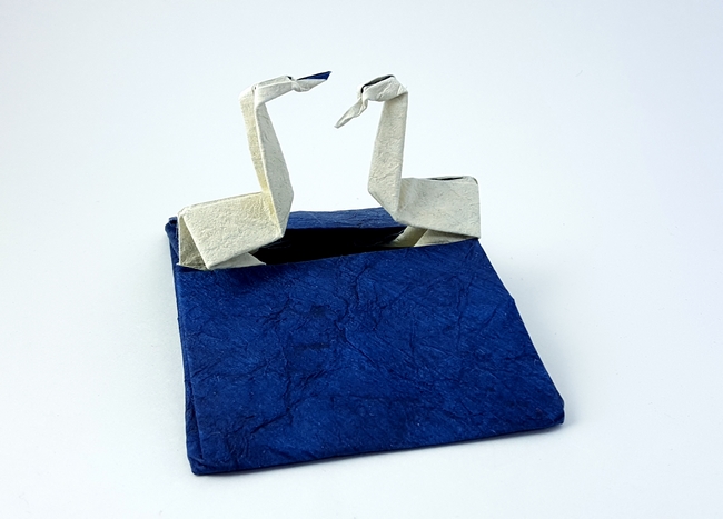 Origami Swan couple card by Sy Chen. Folded from a square of Crinkle Blue scrapbooking paper by Gilad Aharoni on giladorigami.com