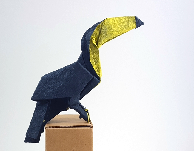 Origami Toucan by Victorien Rami. Folded from a square of Duo Thai paper by Gilad Aharoni on giladorigami.com