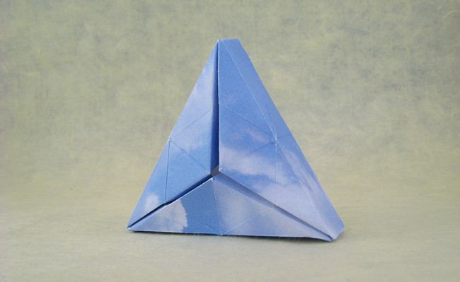 Origami Triangular solid by David Shall. Folded from a squares of scrapbooking paper by Gilad Aharoni on giladorigami.com